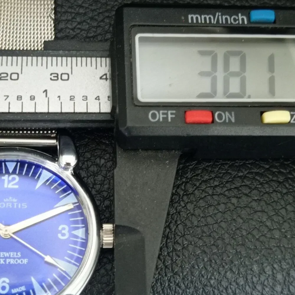 Vintage 1976 Fortis Manual Mens Silver Watch W/Steel Strap & Blue accents
